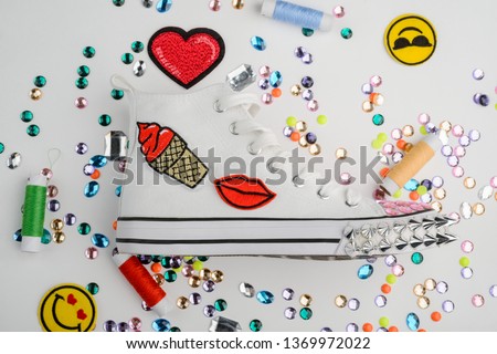 Canvas sneakers, embroidered patches and lots of rhinestones. Handmade customization of favorite pair of shoes.