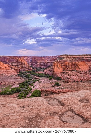 Canyon de Chelly's dramatic sky provides a stunning backdrop to the canyon's landscape. 