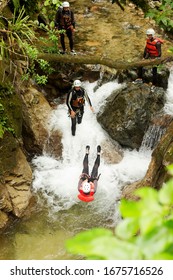 Canyoning Team Performing A Backflip Inside A Tiny Waterfall Sport Jump Courage Canyon Water Team Stone Flow Danger Earth Dynamic Outside Falls Expedition River Practice Canyoning Exterior Landscape C