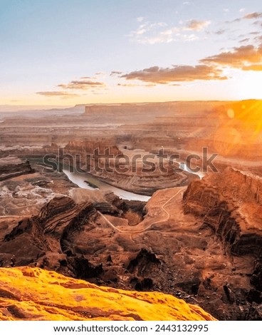 Canyonlands Majesty: Dramatic Sunset Illuminates Rocky Terrains and Pristine Waterscapes - Inspiring Visual Storytelling for Calendars, Posters, and Environmental Campaigns.”