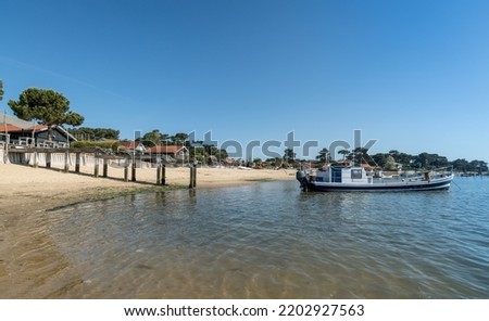 Cap Ferret (Arcachon bay, France). Oyster farmer's barge in front of the beach of the oyster village of Le Canon