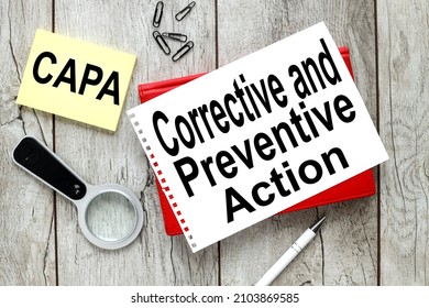 CAPA. Corrective and Preventive action plans. Business management concept. Strategy and efficiency. Improving organizational processes. desktop with office accessories, notepad and colorful stickers.