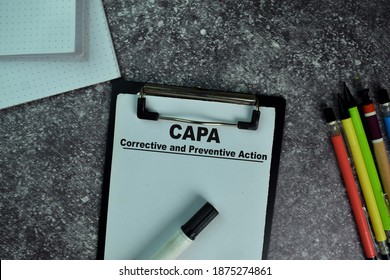 CAPA - Corrective and Preventive Action write on a paperwork on the table. Selective focus on CAPA - Corrective and Preventive Action Text