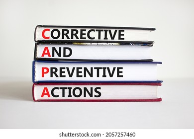 CAPA synbol. Concept words 'CAPA, corrective and preventive actions' on books on a beautiful white background. Business and CAPA, corrective and preventive actions concept. Copy space.