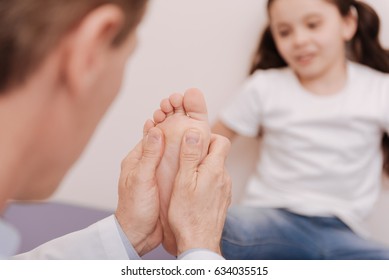 Capable Trained Rheumatologist Treating Patients Feet