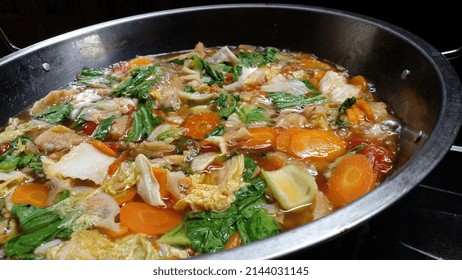 Capcay Or Cap Cai Is Being Cooked In A Wok Pan. Indonesian Chinese Food. Capcay Is Made From Various Kinds Of Vegetables Such As Carrots, Mustard Greens, Chinese Cabbage, Tomatoes, And Cabbage.