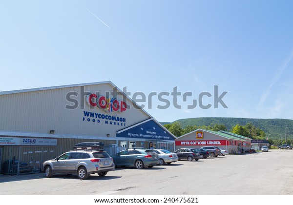 CAPE BRETON, CANADA - 25TH AUGUST 2014: The
outside of a CO-OP and Home Hardware store in Cape Breton. Hills
can be seen in the distant