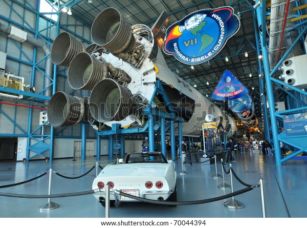 CAPE\
CANAVERAL, FL- DEC 28: A classic white Corvette and Saturn V rocket\
displayed in the Apollo/Saturn V Center, at the Kennedy Space\
Center, NASA in Florida on December 28,\
2010.