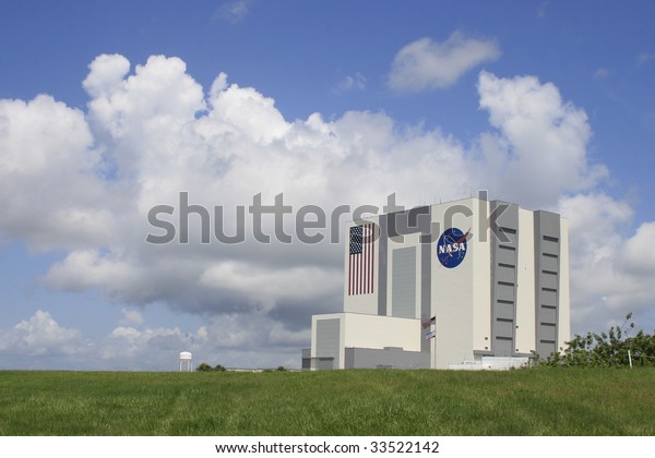 CAPE CANAVERAL, FL - JULY 11: Clouds form around\
NASA\'s Vehicle Assembly Building prior to the canceled launch of\
launch of STS-127 from Kennedy Space Center on July 11, 2009 in\
Cape Canaveral, Fl.