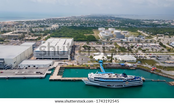 Cape Canaveral, Florida/USA - May\
27, 2020: Aerial view on Port Canaveral is a cargo, cruise, and\
naval port in Brevard County, Florida, United\
States.