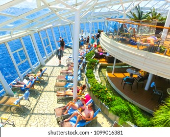 Cape Canaveral, USA - April 29, 2018: The People Resting At Solarium On The Royal Carribean Cruise Ship Oasis Of The Seas At Cape Canaveral, USA On April 29, 2018