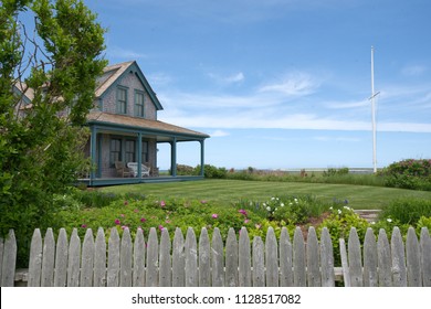 A Cape Cod Styled House With Cedar Shake Siding Sits Near The Harbor On Island Of Nantucket