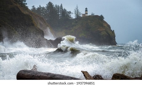 Cape Disappointment Lighthouse Waves Crashing Over The Drift Wood At Cape Disappointment State Park