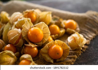 Cape gooseberry or physalis minima on wood background. Tropical fruit and food for health concept. - Powered by Shutterstock