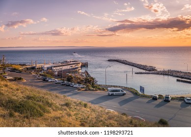 Cape Jervis, AUSTRALIA - Oct 07, 2018:  Sealink ferry departing the terminal in Cape Jervis towards Penneshaw, Kangaroo Island at sunset