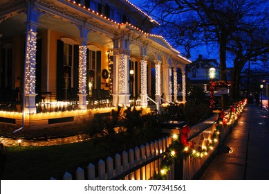 Cape May, NJ, USA December 12 Christmas Lights Strewn On A Picket Fence Glow In The Historic Victorian Neighborhood In Cape May, New Jersey