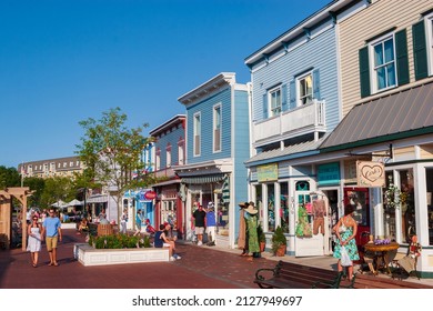 Cape May, NJ, USA, July 4, 2009: Tourists walk through Washington Street Mall, lined with specialy boutiques, eateries and shops. Cape May is considered one of the most beuatiful towns in the US. 