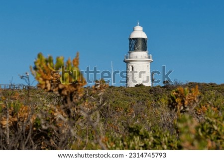 Cape Naturaliste Lighthouse in the south west of Western Australia, high cylindrical white tower with Fresnel lens, built of limestone quarried from nearby Bunker Bay.