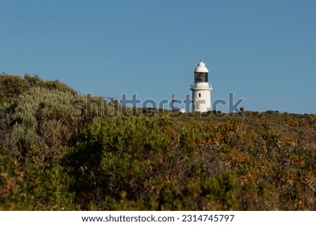 Cape Naturaliste Lighthouse in the south west of Western Australia, high cylindrical white tower with Fresnel lens, built of limestone quarried from nearby Bunker Bay.