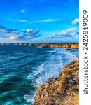 Cape Sagres, lighthouse, ocean, southwest, Europe, Portugal, Algarve. Rocks, rocky shore, yellow rocks, coquina, beautiful coastline