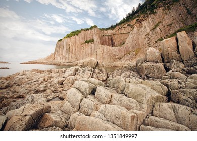 Cape Stolbchaty, geographic cape on the east shore of Kunashir Island of Sakhalin Oblast, Russia. Composed of layers of basaltic lavas of the Mendeleyev volcano. - Shutterstock ID 1351849997