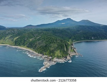 Cape Stolbchaty and Mendeleev Volcano on Background, Kunashir island, Russia.