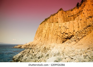 Cape Stolbchaty. Cape on the west coast of the island of Kunashir. It is composed of layers of basaltic lavas of the Mendeleyev volcano. - Shutterstock ID 1209926386