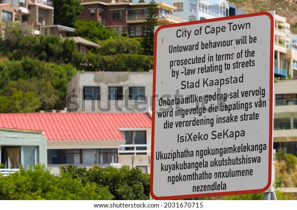 Cape Town - February 19, 2021:  sign for public\
awareness in three official languages of South Africa namely\
English, Afrikaans and\
Xhosa