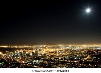 Cape Town Harbor And City At Night With Moon In The Sky