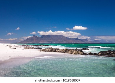 cape town scenic view of table mountain from blouberg with blue sky and white clouds in summer