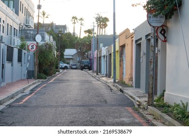 Cape Town, South Africa 18-06-2022

Quiet Street Near Bayview Terrace During Sunset. Colorful Buildings And Road In Foreground.