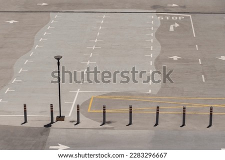 Cape Town, South Africa 2023. Rooftop car park with marked spaces and directional arrows.