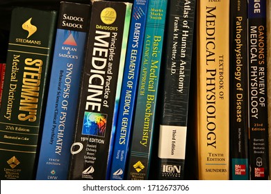 Cape Town, South Africa - April 24, 2020: Various Used Medical Books On A Shelf. Studying Medicine Concept Image.