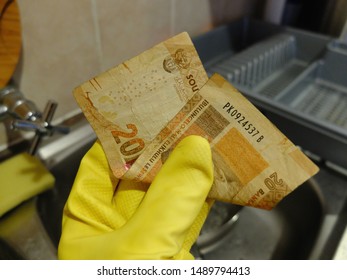 Cape Town, South Africa - Aug 6, 2019: Domestic Worker Holds Twenty South African Rand Note, The Minimum Hourly Wage For Workers In South Africa Since January 1, 2019 (National Minimum Wage Bill).