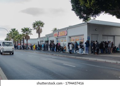 Cape Town, South Africa - August 2020: Covid Relief Funds In South Africa. Long Lines For People Waiting For  Money To Feed Themselves. Poverty In Africa. People Waiting Hours For 20 Dollars.