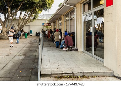 Cape Town, South Africa - August 2020: Covid Relief Funds In South Africa. Long Lines For People Waiting For  Money To Feed Themselves. Poverty In Africa. People Waiting Hours For 20 Dollars.