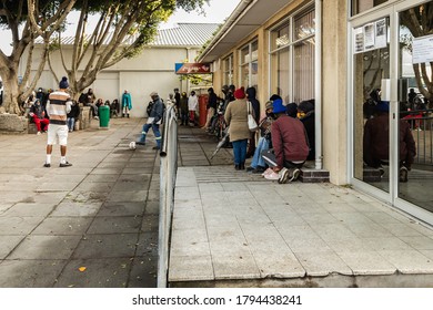 Cape Town, South Africa - August 2020: Covid Relief Funds In South Africa. Long Lines Desperate Unemployed People Want Money To Feed Themselves. Poverty In Africa. People Waiting Hours For 20 Dollars.