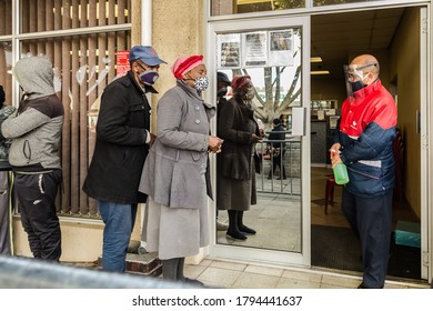 Cape Town, South Africa - August 2020:  Corona Virus Relief Funds In South Africa.Elderly People Waiting Hours For 20 Dollars To Survive For A Month. Face Masks, Corona Virus Pandemic In Africa