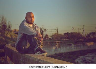 Cape Town, South Africa - August 2020: Young Mixed Race African Man With Mental Health Issues Contemplates Suicide Due To Covid 19 Pandemic Stress