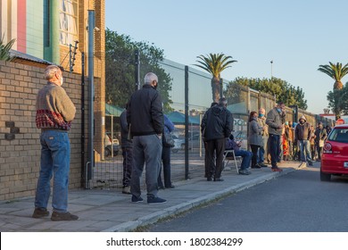 Cape Town, South Africa - August 2020: Old Age Pensioners Stand In Long Lines Waiting For Help From Government, Covid 19 Relief Funds. Corona Virus Pandemic In Africa. 