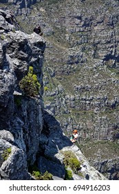 CAPE TOWN, SOUTH AFRICA - CIRCA NOVEMBER 2016: Abseiler Going Over The Edge Of Table Mountain