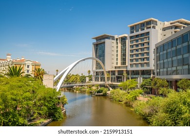 CAPE TOWN, SOUTH AFRICA - February 11, 2022: View Of A Modern Design Bridge And The Surroundings In The Recently Developed Century City Suburb Of Cape Town.