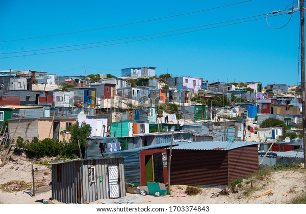 cape town, south\
africa, february, 10, 2020: shacks in informal settlement in\
khayelitsha township, 