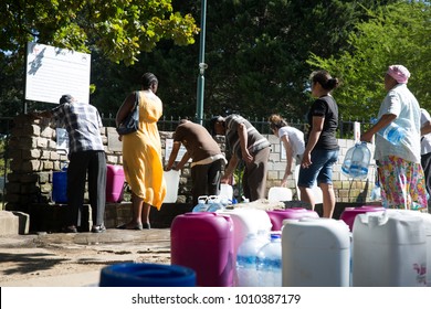 Cape Town / South Africa - January 25, 2018: Lines of people waiting to collect natural spring water for drinking in Newlands in the drought in Cape Town South Africa