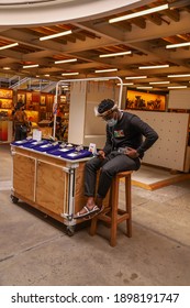 Cape Town, South Africa - January 2021: African Retail Worker Wearing Face Mask For Protection From Covid 19. Zulu Man Wearing Mask And Traditionally African Head Wear.