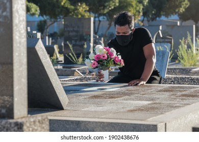 Cape Town, South Africa - January 2021: Mixed Race Man, Sad And Depressed At The Funeral Of A Loved One Due To Covid 19, Corona Virus Mental Health During Covid 19 Pandemic. Covid 19 Funeral.