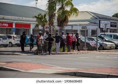 Cape Town, South Africa - January 2021: Poor Unemployed Mixed Race South Africans Standing In Long Line Waiting For Covid Relief Funds. Corona Virus In Africa.