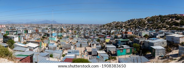 Cape Town,\
South Africa - January 28, 2021: Township number grow as land grab\
makeshift house are made and informal settlement grow and more\
shacks are build in Cape Town South Africa. \
