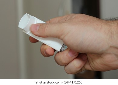 Cape Town, South Africa - July 07, 2019: Hand Holding An Asthma Pump. Chronic Medical Condition Concept Image. 