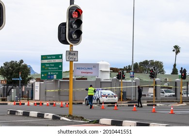 Cape Town, South Africa - July 2021: Traffic Cop Closes Road For Crime Scene Investigation. Taxi Violence In South Africa 